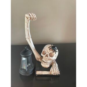 Flawed Halloween skeleton skull holding solar powered lantern home decoration